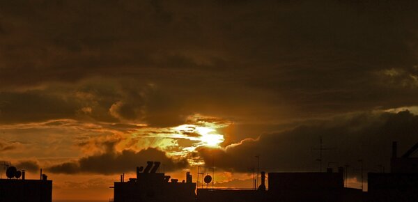 Sunset,clouds And Rooftops